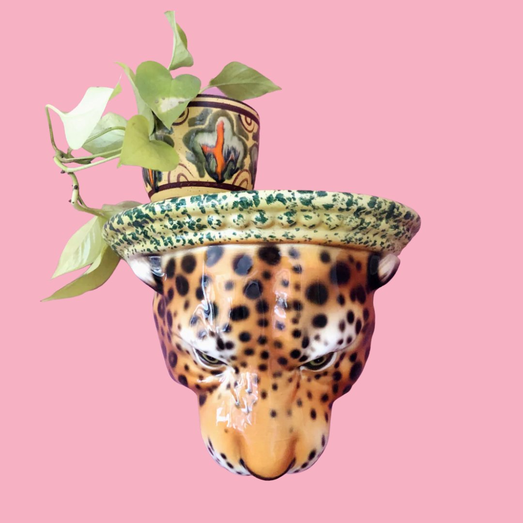 CERAMIC leopard head shelf plinth on pink background